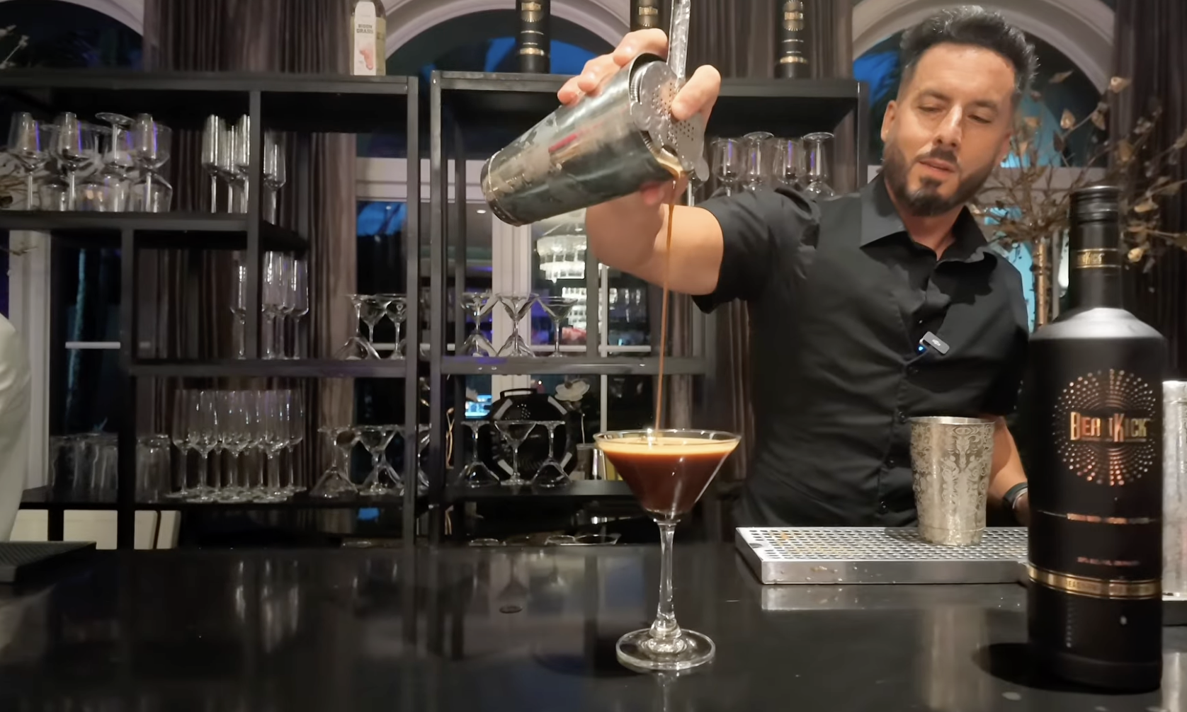 Bartender pouring a BeanKick espresso martini